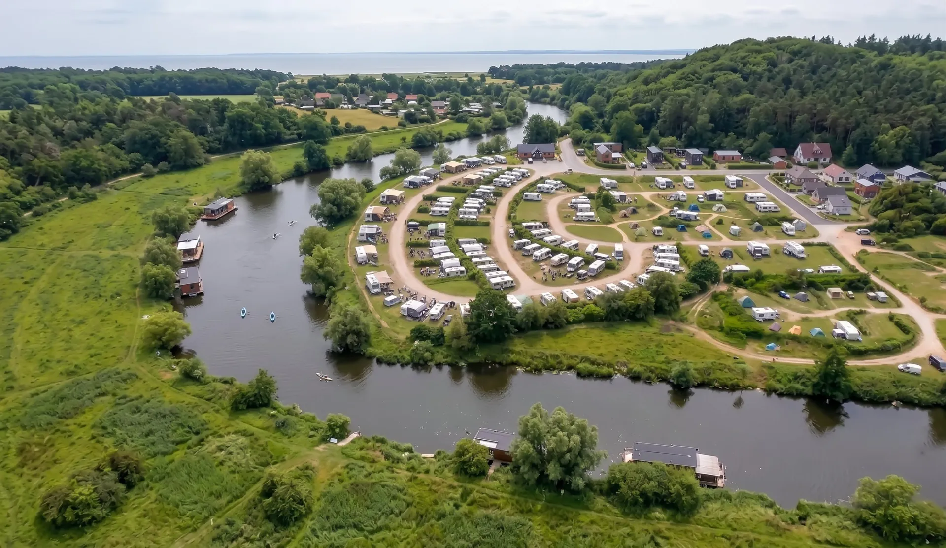 Camp and houseboats on a bend in the river